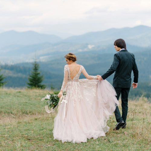 Running couple enjoying honeymoon adventure